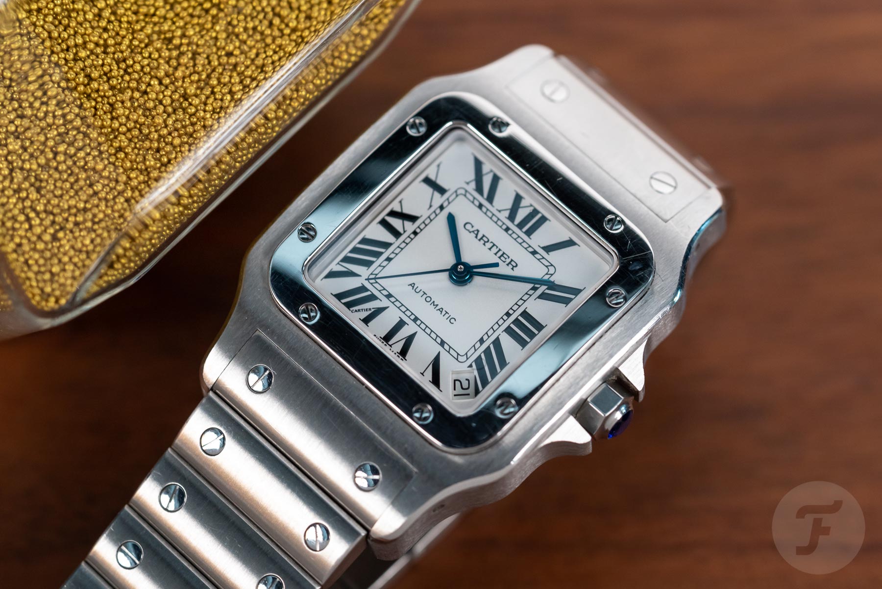 Sunday Morning Showdown: Cartier Santos Vs. Omega Speedmaster Professional