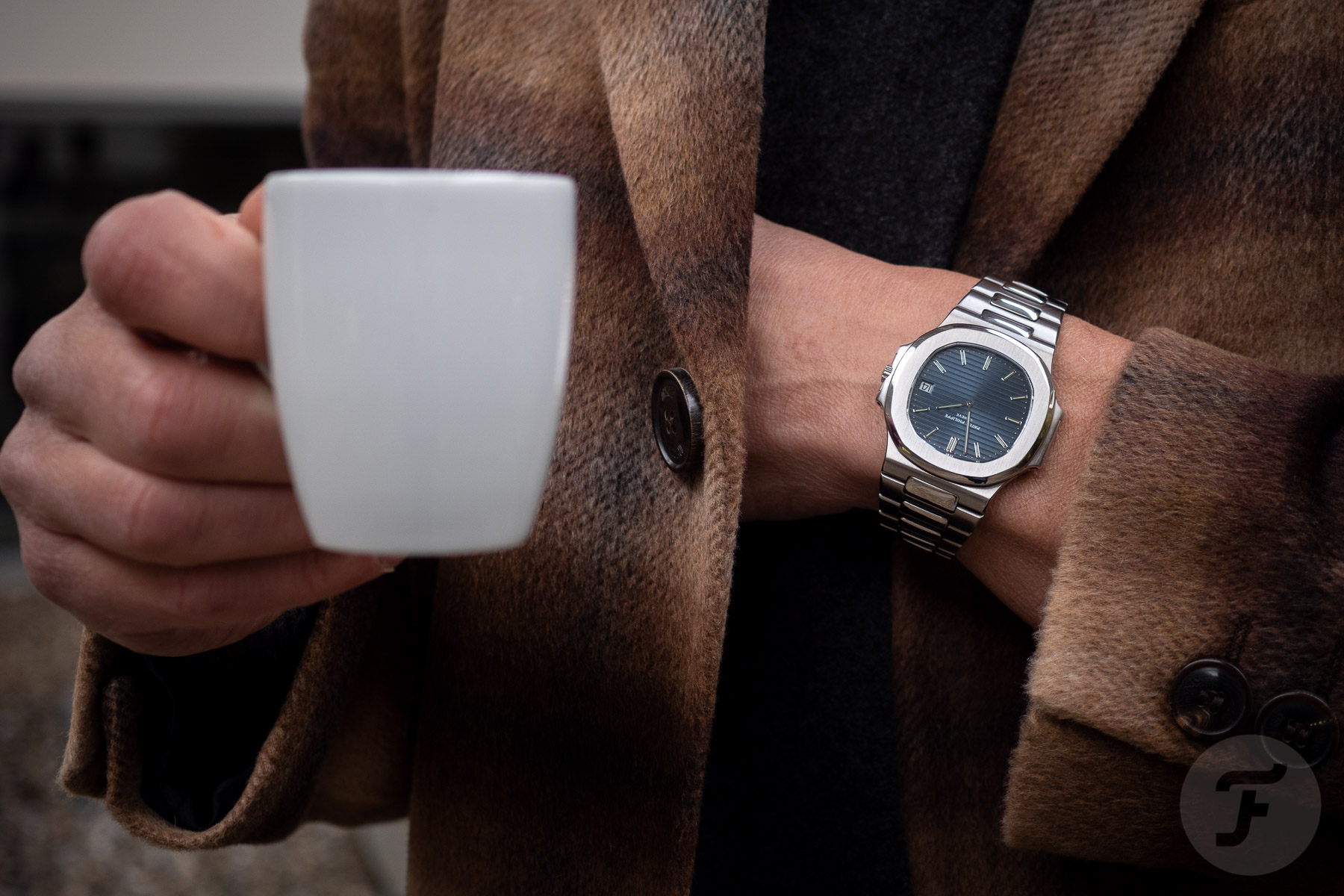 Casually Sipping A Coffee With The Legendary Patek Philippe Nautilus 3700/1A “Jumbo” On The Wrist