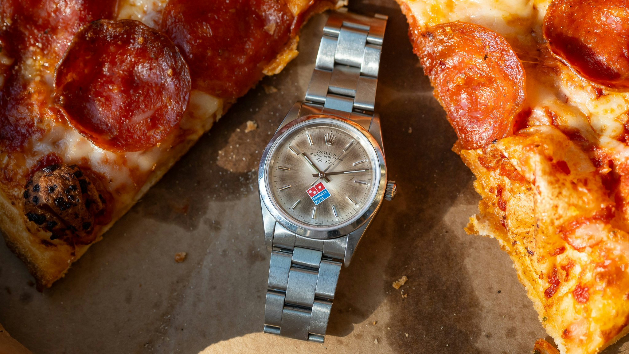 Buying, Selling, & Collecting: The Domino’s Rolex Air-King With A Slice Of Pizza
