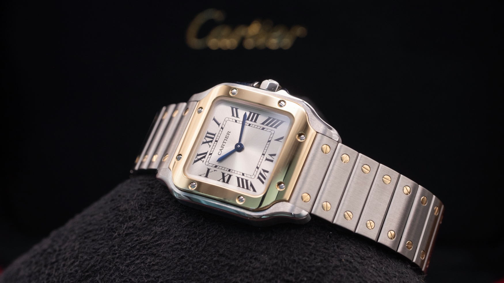 The itty bitty Santos de Cartier still delivers oodles of two-tone charm